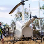 Riders unloading bikes from helicopter