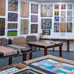 Monthly feature artist display, loose paintings, artifacts, Zebra stone, cultural information