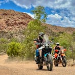 Adventure bikes riding through the picturesque Eastern MacDonnell Ranges