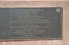 One of four commemorative plaques fixed to the memorial base.