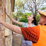 People feeling a porcelanite wall