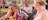 Two women join a Murrumburr Clan elder in weaving a pandanas piece.