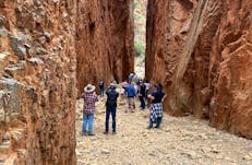 a group of people standing in a chasm