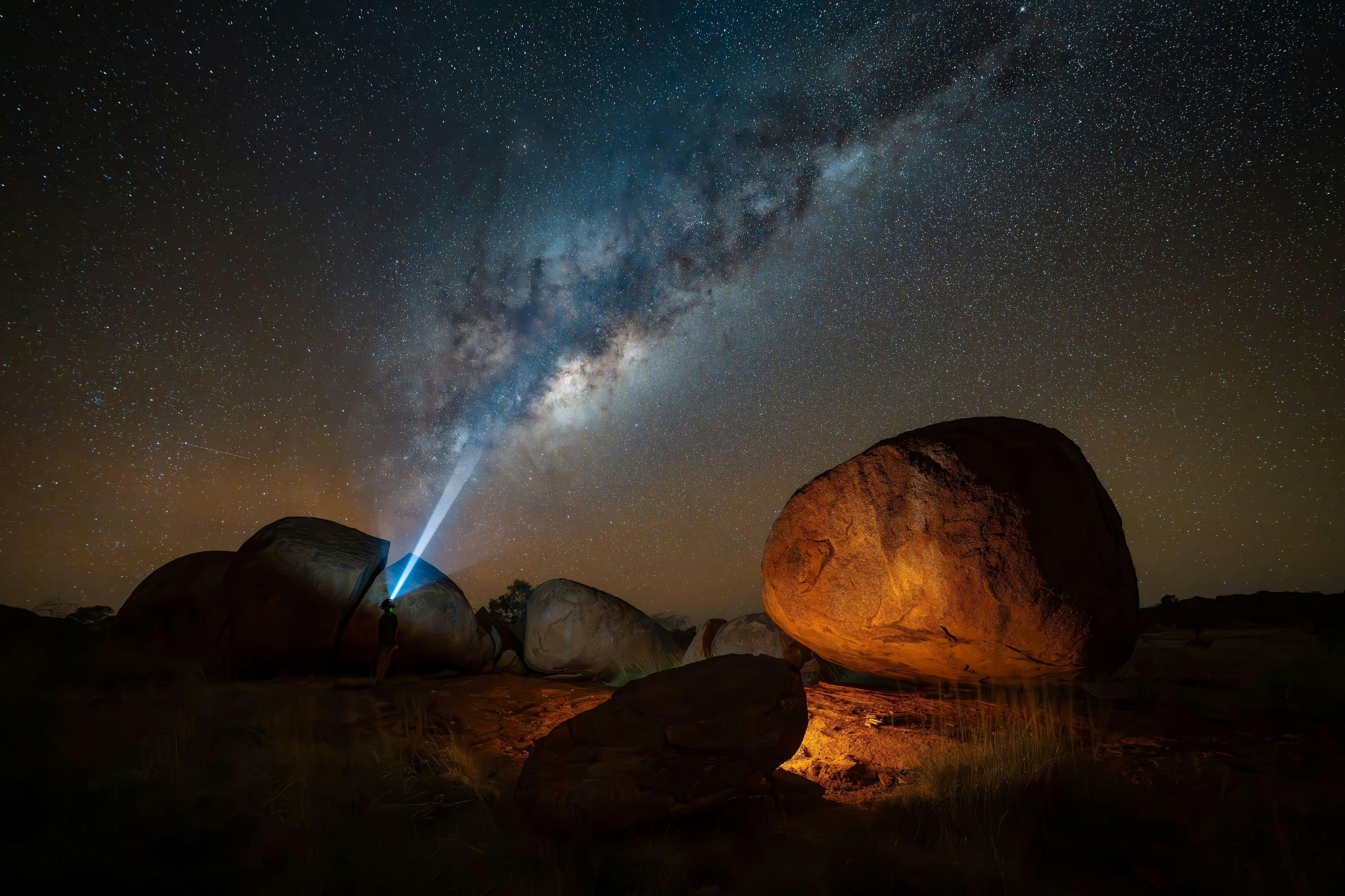 The Milky Way is seen over Karlu Karlu / Devils Marbles Conservation Reserve