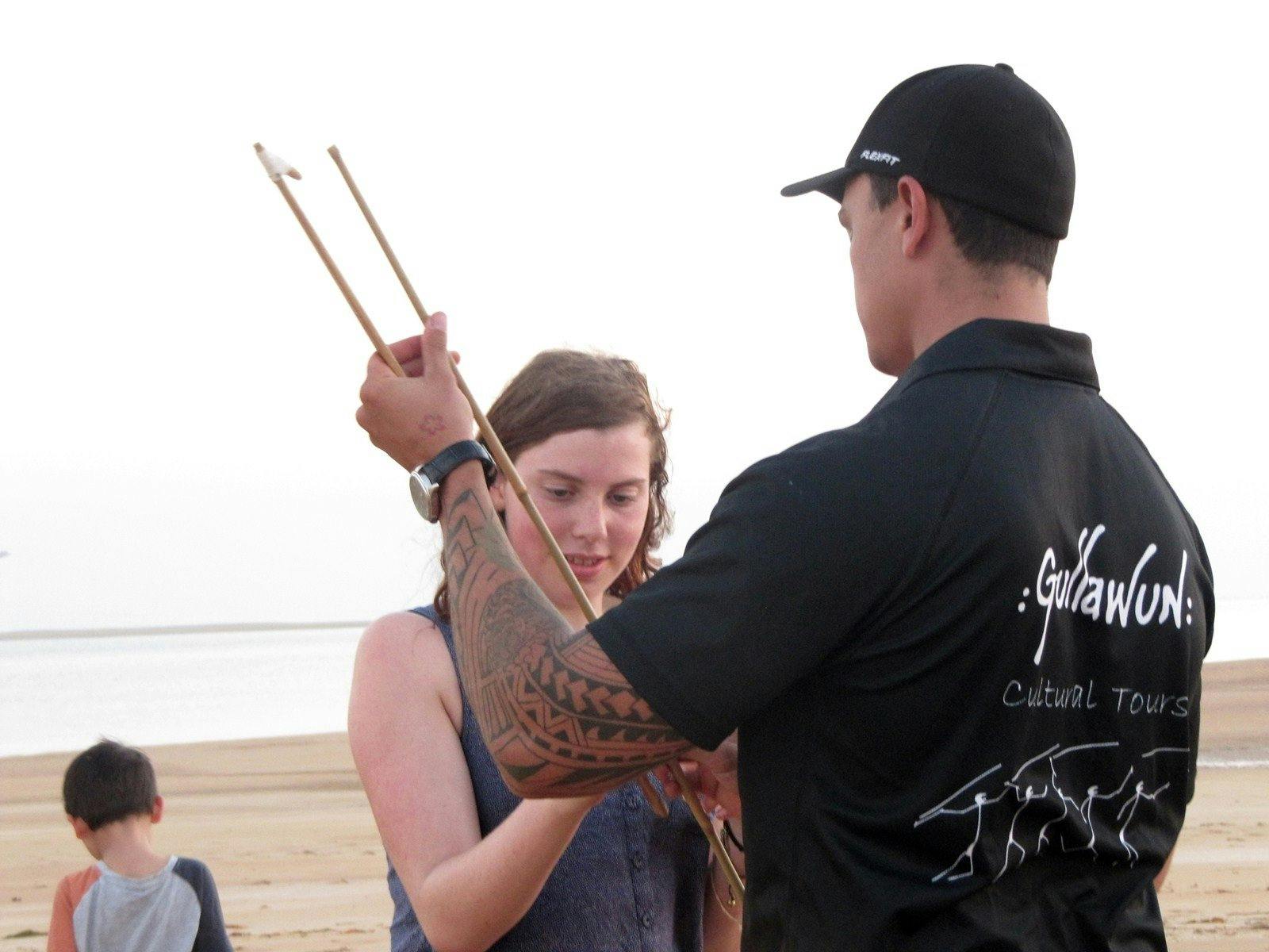 Shannon from Sail Darwin teaching Louise how to throw a spear with a woomera