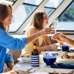 Group of people at different tables enjoying their buffet meal