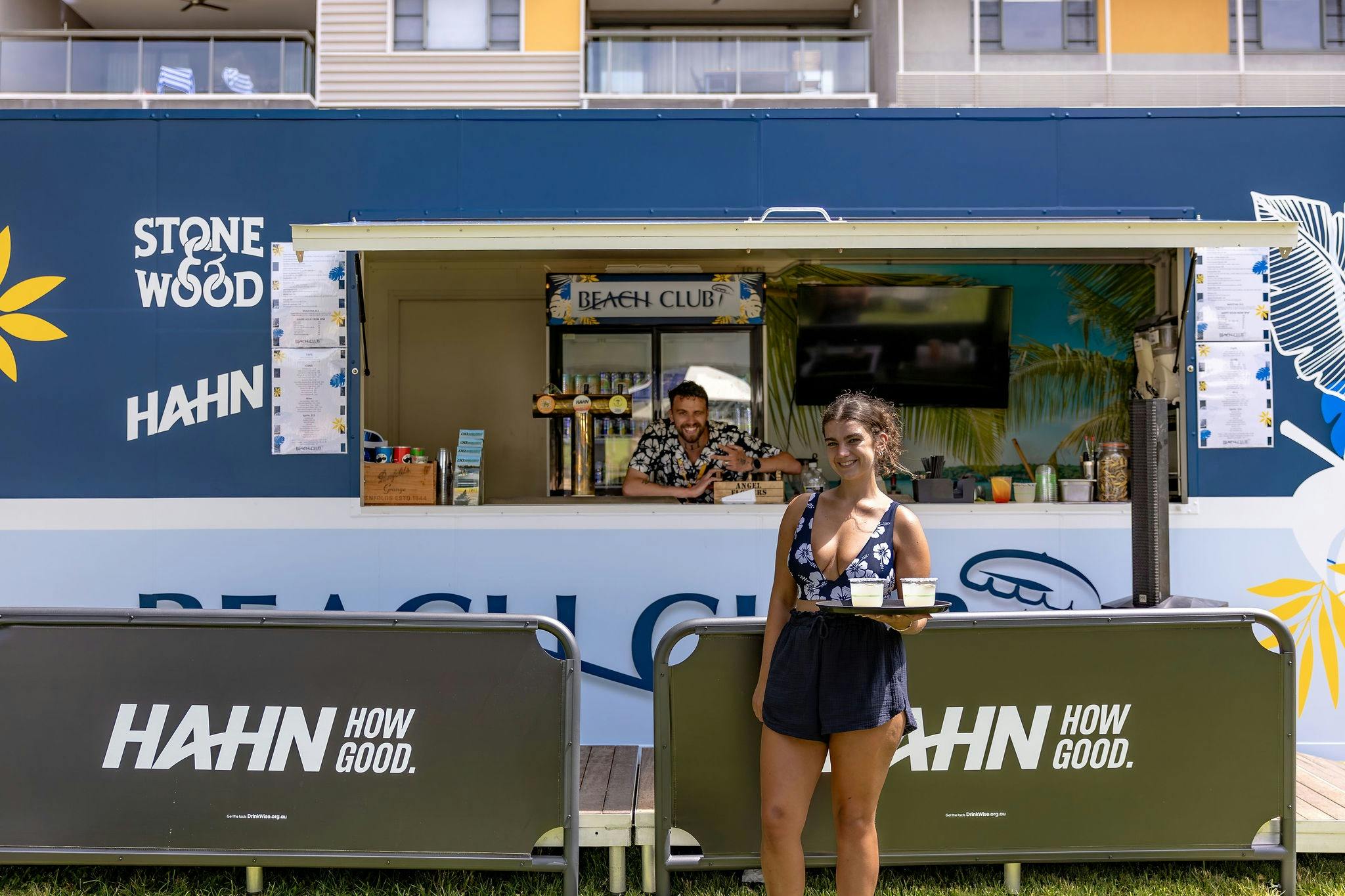 Beach bar staff serving cocktails
