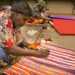Works in progress by Eileen Anyama (front), Eunice Napanangka Jack and Kumantjai Nolan