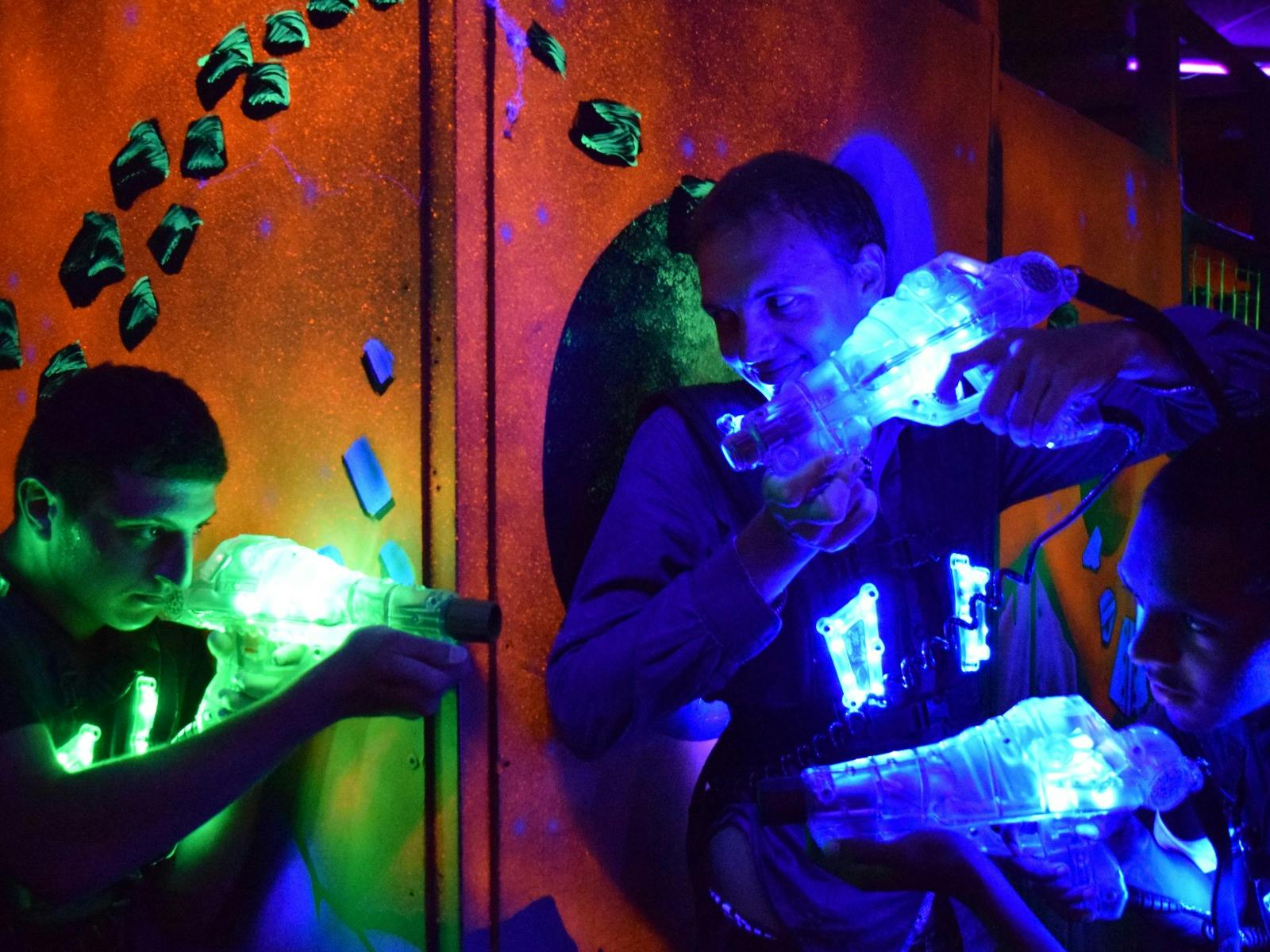 adults playing laser tag