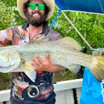 man on boat with Barra