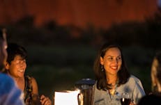 Woman having dinner at Uluru