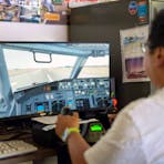 Try your hand on the Flight Simulator - volunteers are there to help.