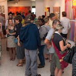 Image of the crowd looking at the artworks for the 2015 SALON des Refusés exhibition opening.