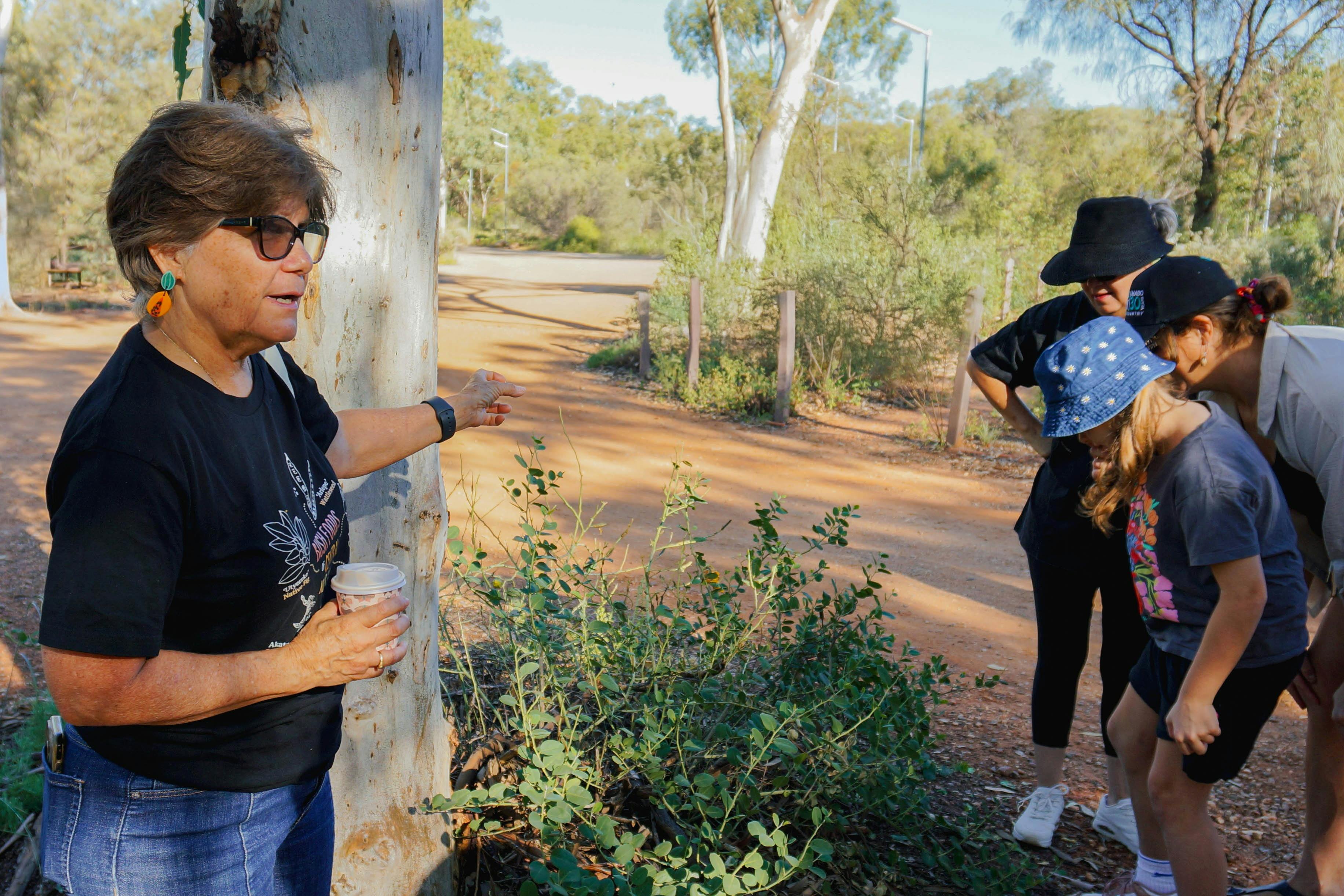 Kungkas Can Cook owner Rayleen Brown delivering a tour at the Olive Pink Botanic Garden