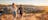 A young couple walking down ANZAC Hill