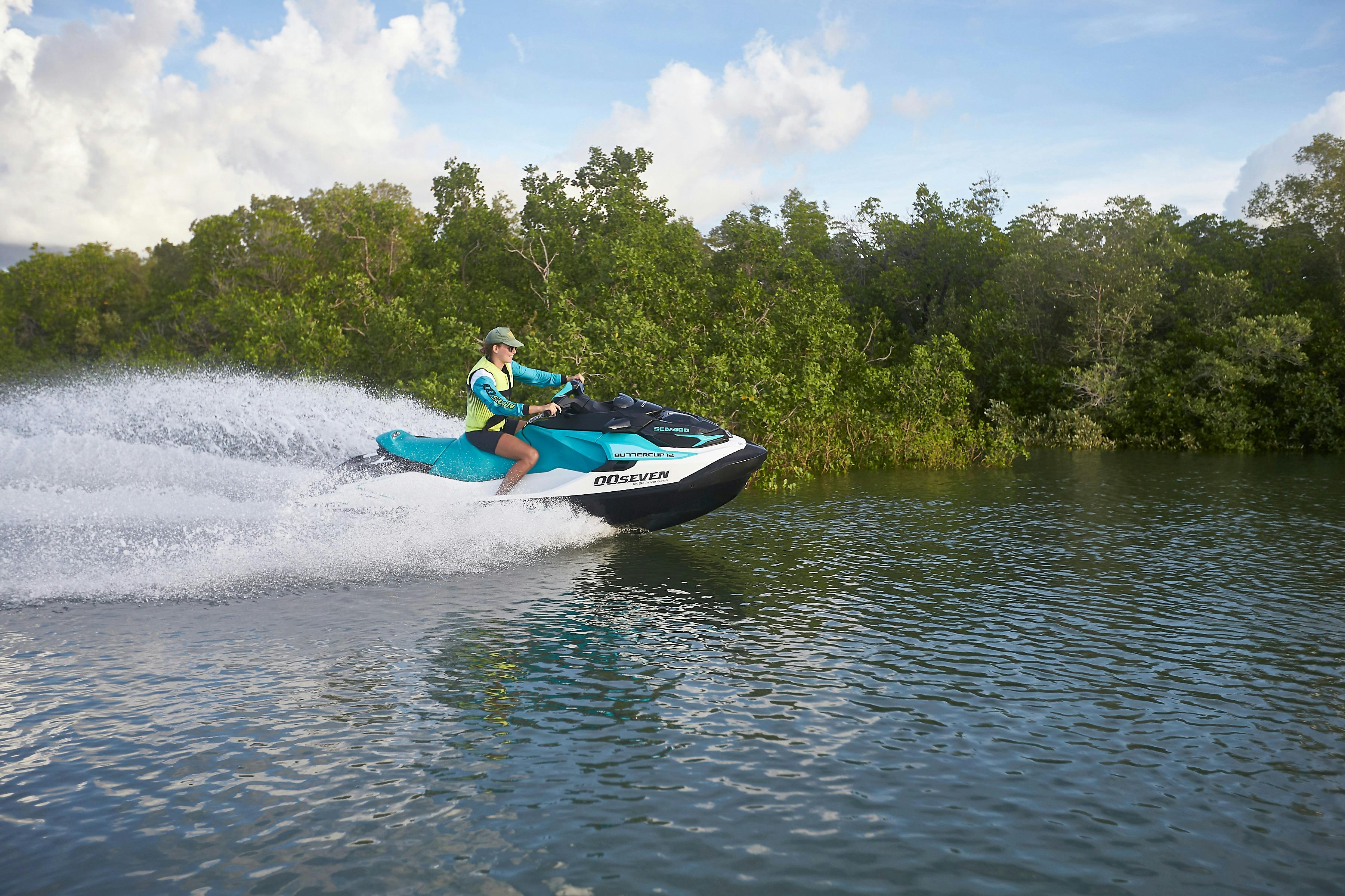 Guide riding a jet ski through the mangroves
