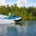 Guide riding a jet ski through the mangroves