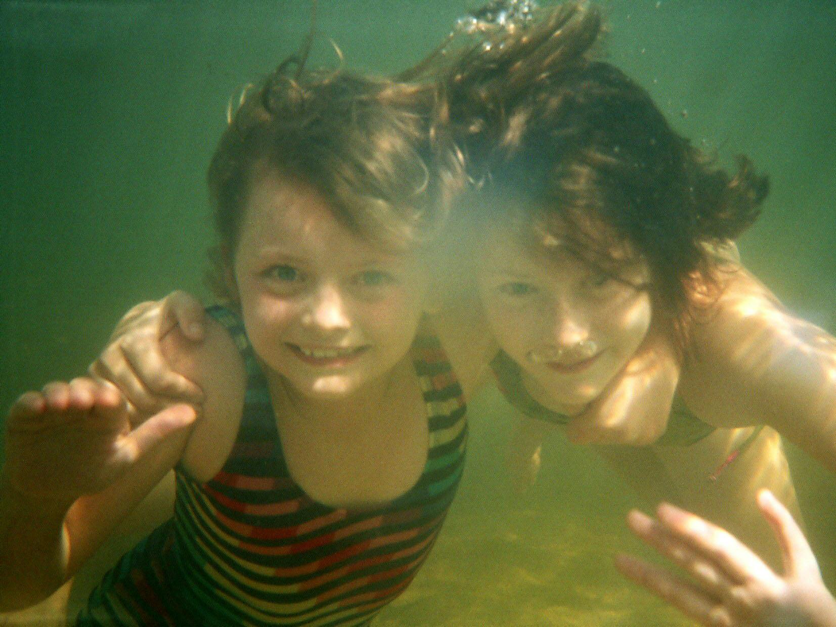 Under water in Kakadu, eyes open and smiling.
