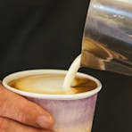 Darwin Ski Club employee pouring a cup of coffee