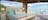 Glamping tent with large windows overlooking the beach