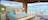 Glamping tent with large windows overlooking the beach