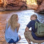 Visitors looking at the water in Simpsons Gap