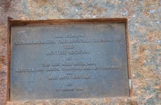 Brass plaque fixed to the memorial.