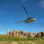A helicopter takes off from the Lost City in Limmen National Park