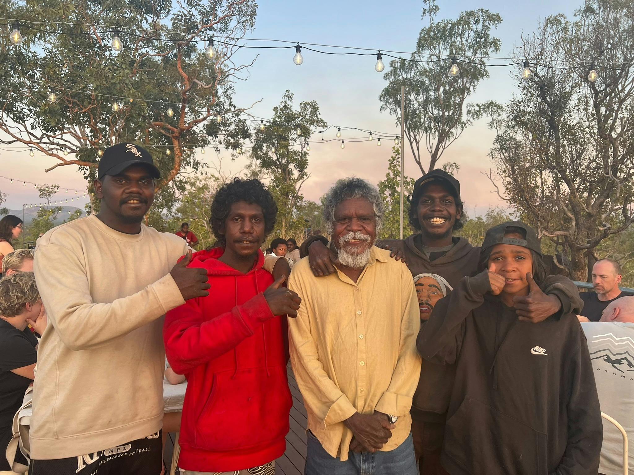 a group of Aboriginal people smile for the camera