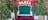Green Santa chair with Christmas tree background & reindeer