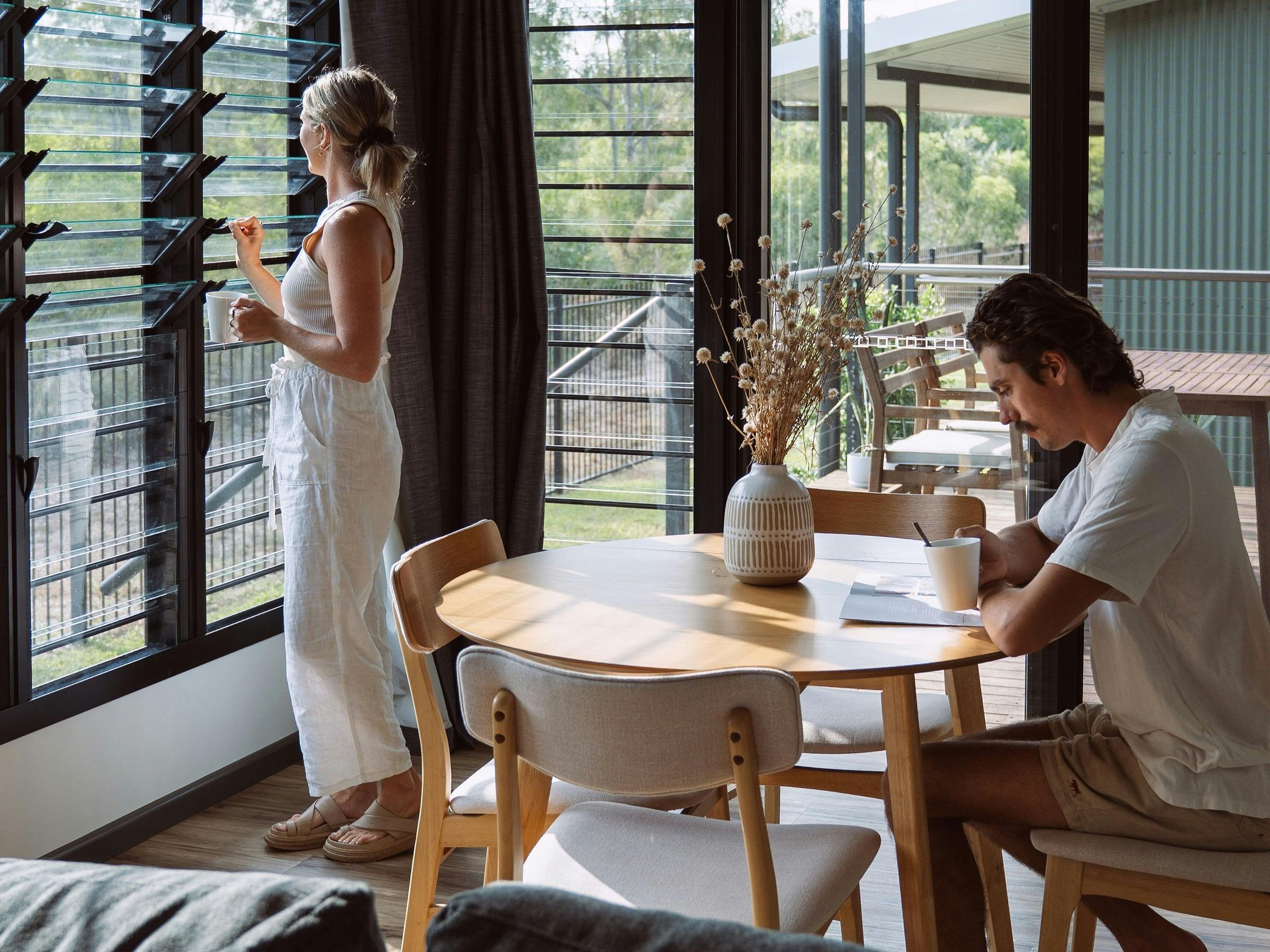 Deck coffee table, bbq, living spaces.