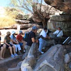 guide talking at ubirr art site