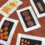 5 paintings on red dirt background