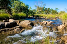 Water gently cascading over rocks on the Victoria River