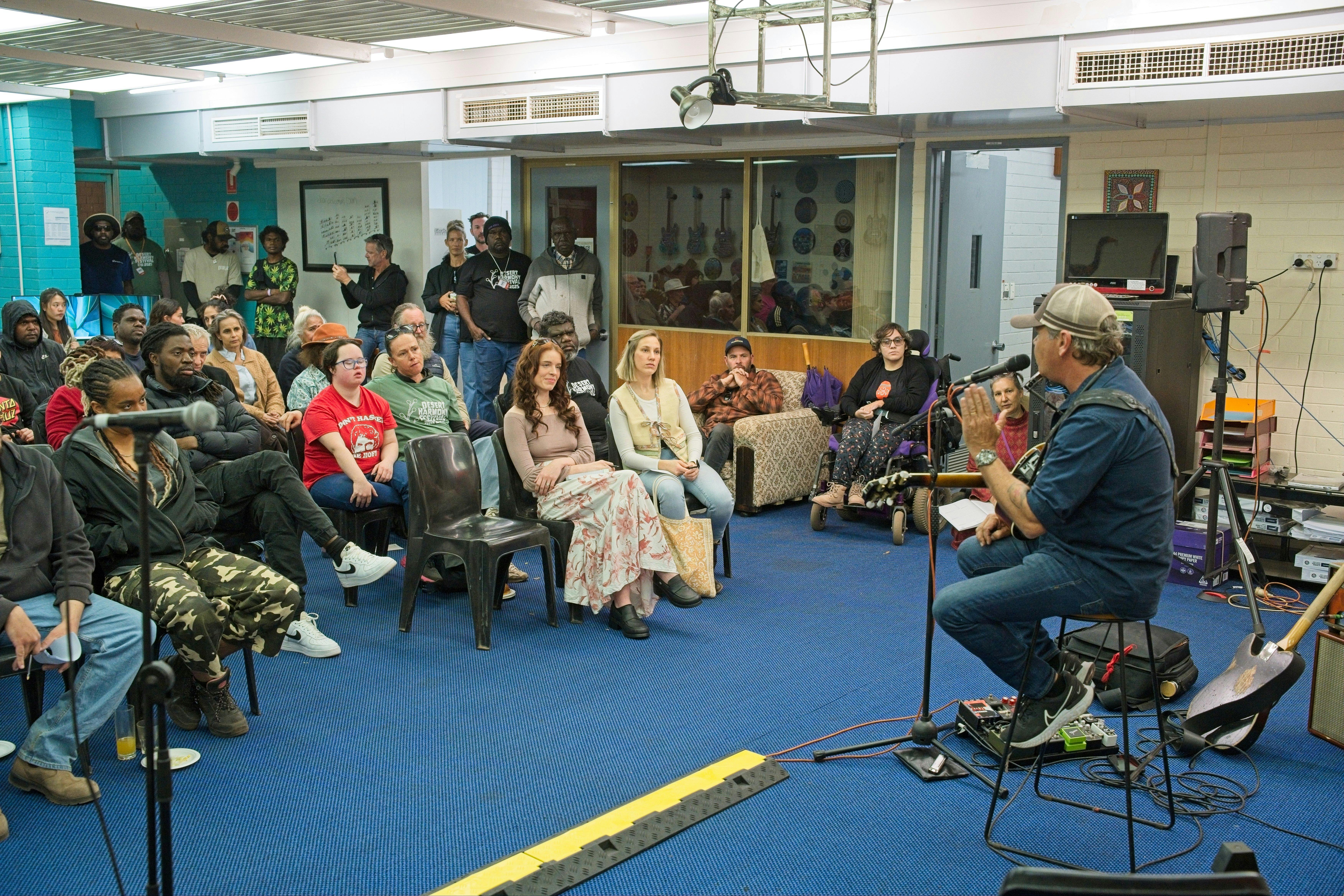 Attendees participating in a songwriting workshop