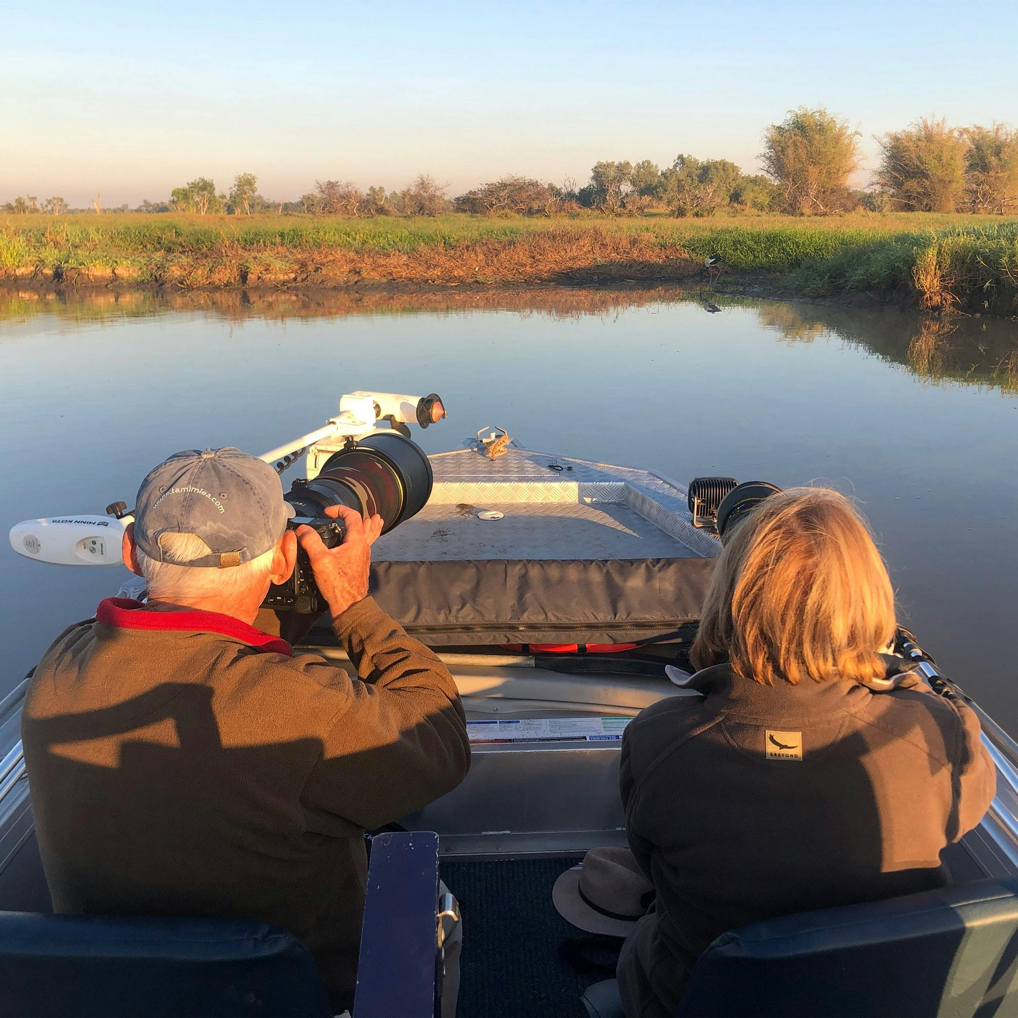 Bird photographers shooting a Jabiru on Corroboree Billabong, Northern Territory