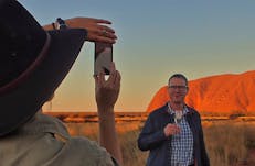 Getting a photo in front of Uluru