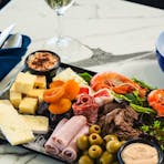 Gourmet grazing platter with prawn, cheese, olives, ham and much more