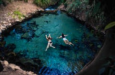 Two girls swimming together in Katherine Hot Springs