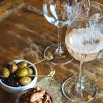 Glasses of wine on a table with snacks