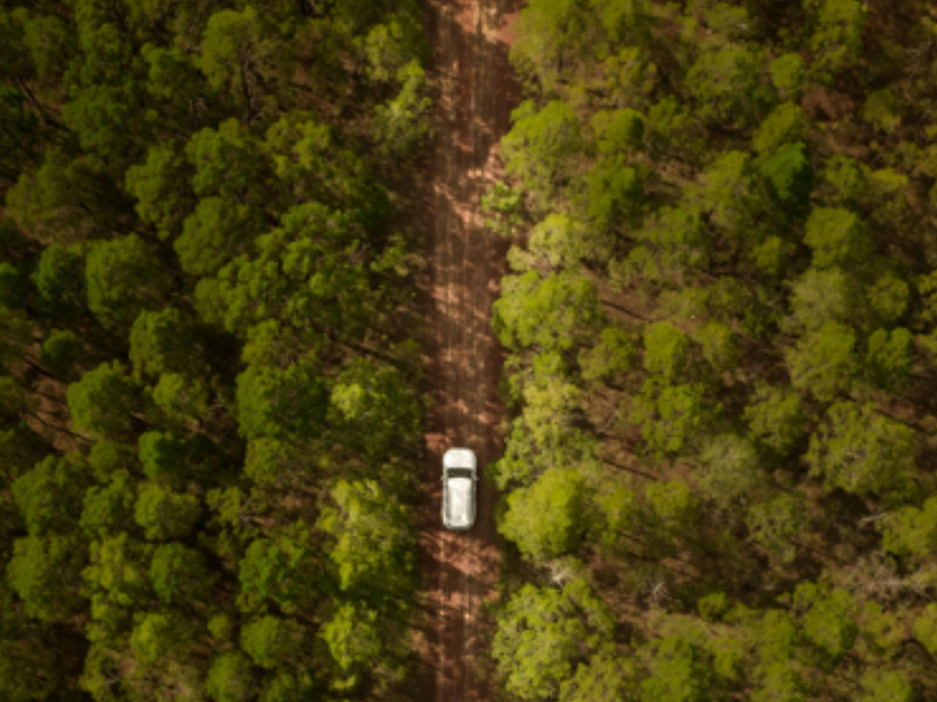 Toyota Prado from aerial view over outback NT bush land.