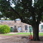 The rear of the building. There is evidence of other structures fixed