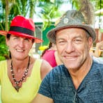 A gentleman and his wife smile for a photo