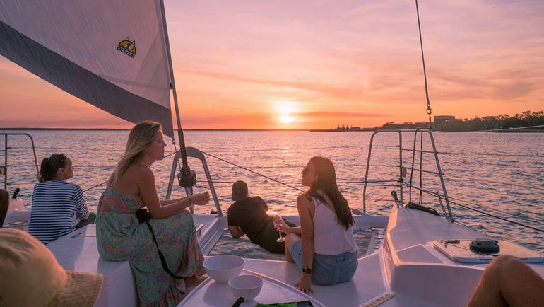 People sailing with Darwin Harbour Cruises at sunset