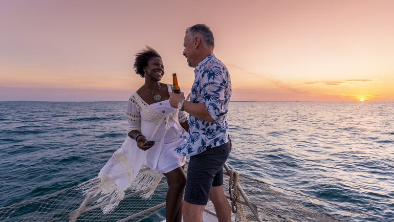 Couple enjoying the sunset with Sail Darwin