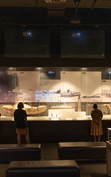 Group of people looking at military displays at the Darwin Military Museum