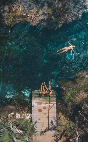 Aerial view of people swimming at Berry Springs