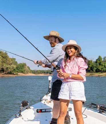 man and woman fishing on the daly river with nt fish 4x4