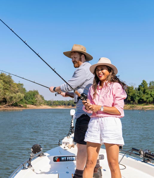man and woman fishing on the daly river with nt fish 4x4