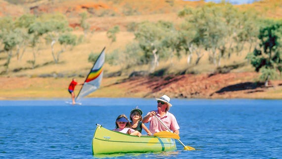 Family kayaking on Lake Maryann near Tennant Creek